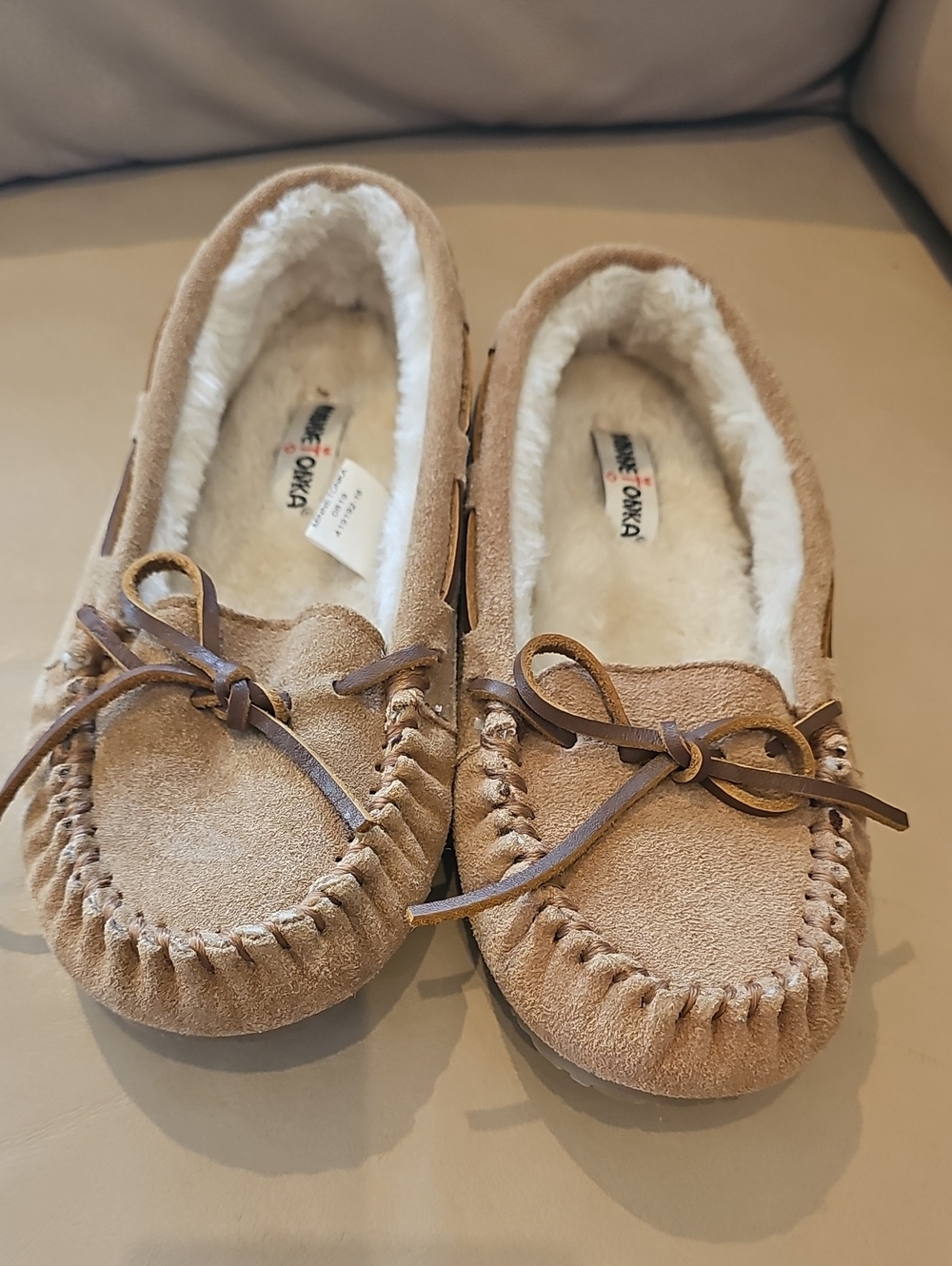 Minnetonka Kids Suede Moccasin Slippers in Light Tan with Bow